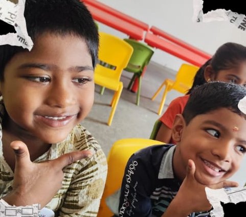 Two boys grinning during an activity