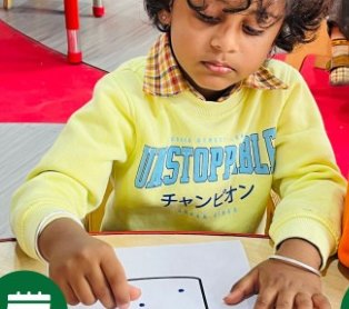 A young child doing a dot painting activity